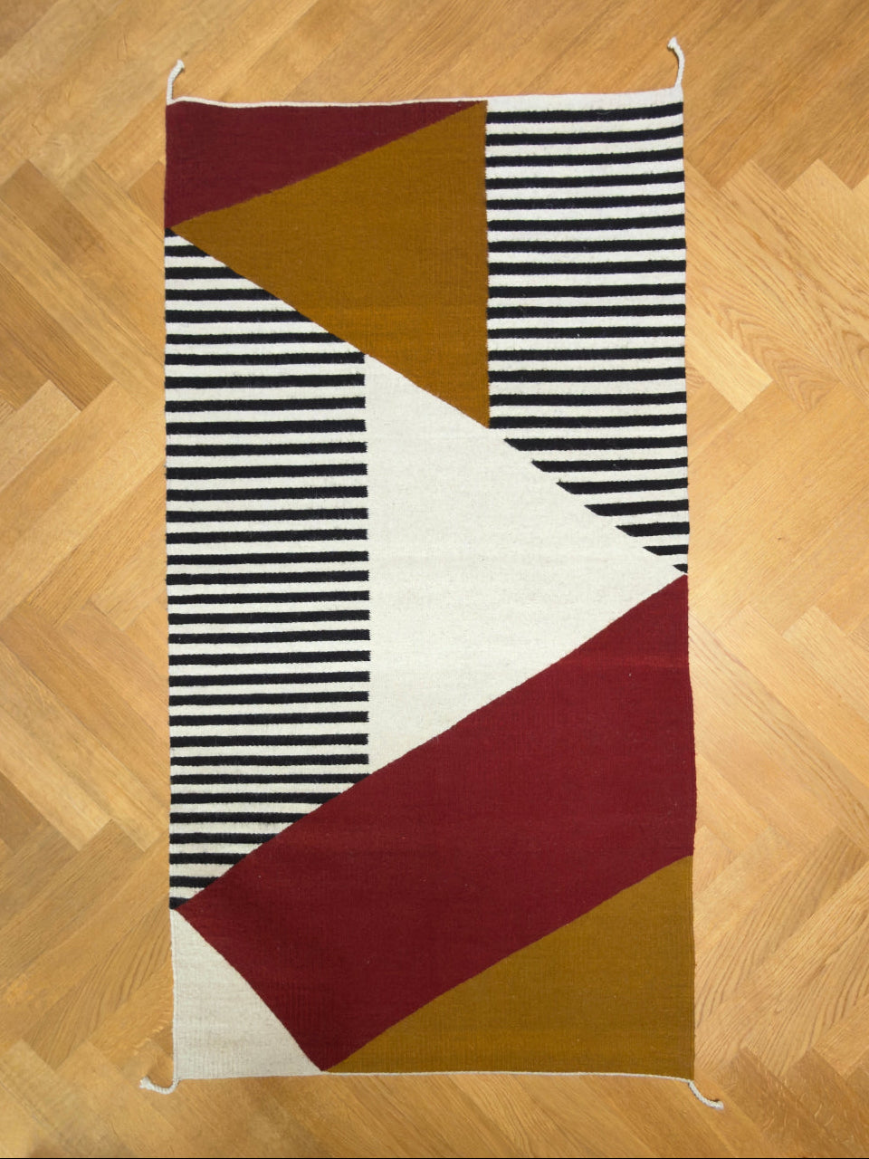 Handmade wool rugs with geometric pattern in black, red, white and okra color - full picture.. Rug made in Oaxaca, Mexico by Zapotec weavers. 